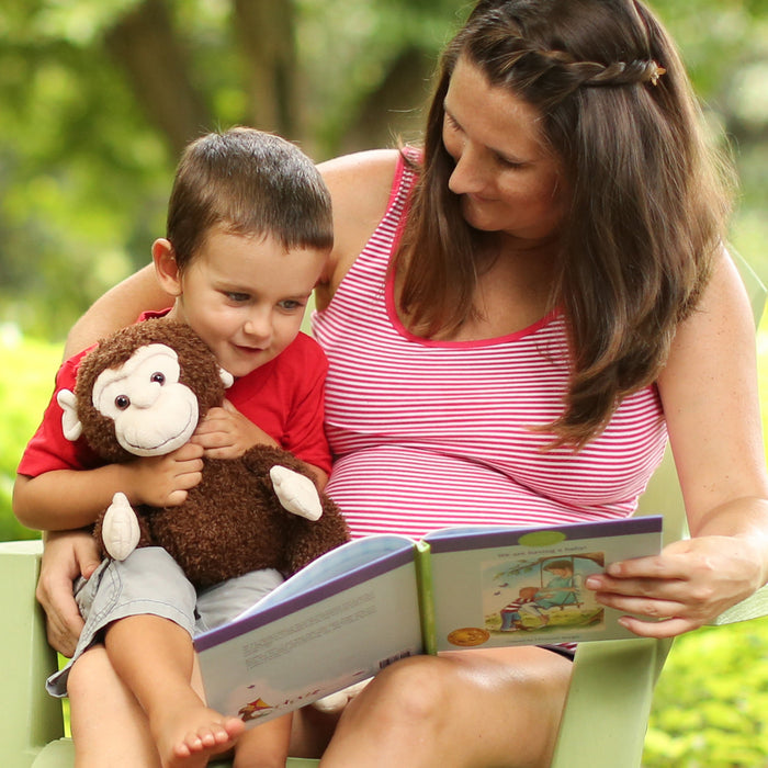 Lifestyle image of “We are having a baby!” Book with Your Buddy Boodles Plush