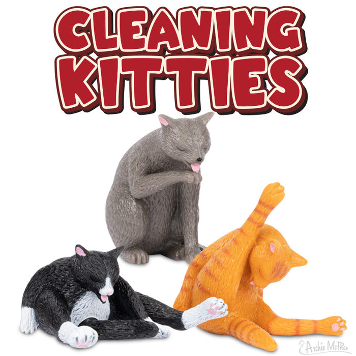 The Cleaning Kitties, a set of three vinyl cat figurines meticulously depicted grooming themselves, are ideal for cat owners who value detailed craftsmanship.