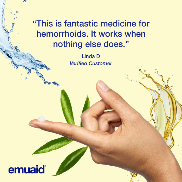 hand applying skincare cream with water and leaves background