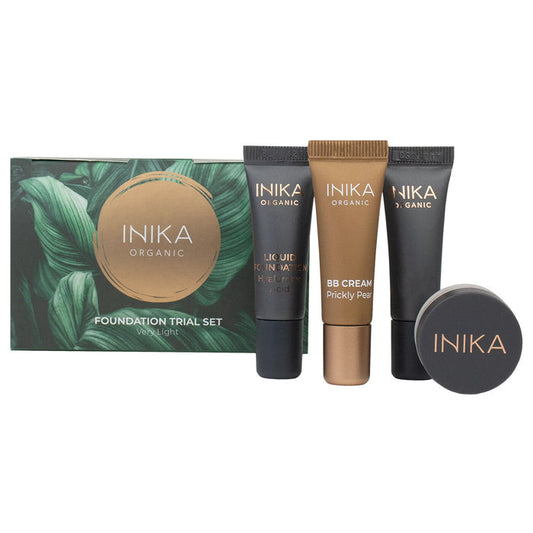 INIKA Organic foundation trial set including BB cream, primer, foundation & loose mineral foundation. Black, green & gold packaging on a white background. Shade - very light.