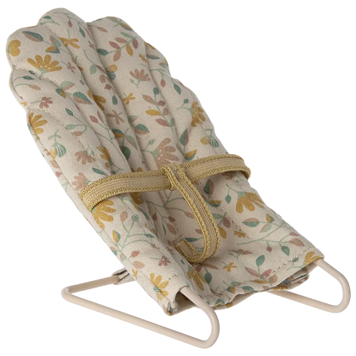A micro baby sitter toy with a metal base and floral fabric covering, designed for micro sized rabbits and bunnies.
