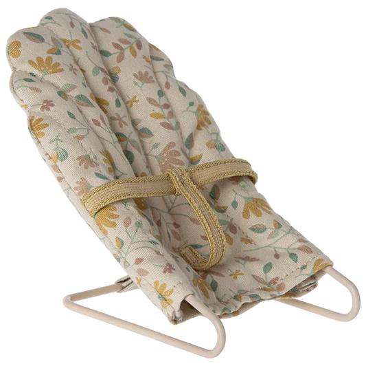 A micro baby sitter toy with a metal base and floral fabric covering, designed for micro sized rabbits and bunnies.
