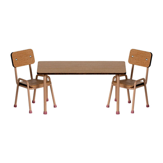 Wooden table with two matching chairs on a white background