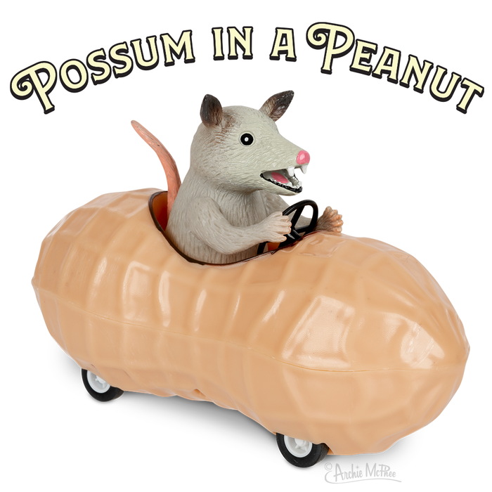 A toy possum is cruising in a peanut car with the product name "Possum in a Peanut" displayed above.