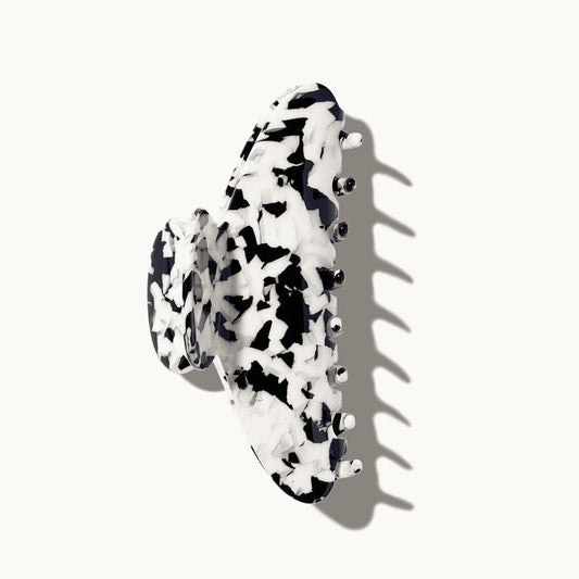 Black and white patterned hair clip on a white background