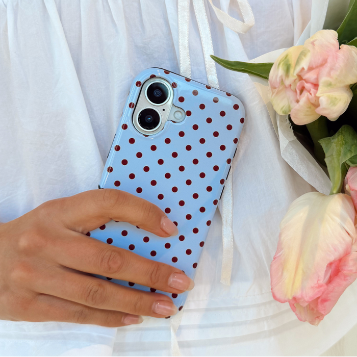 Girl holding flowers with the Blue and Brown Polka Dot Phone Case