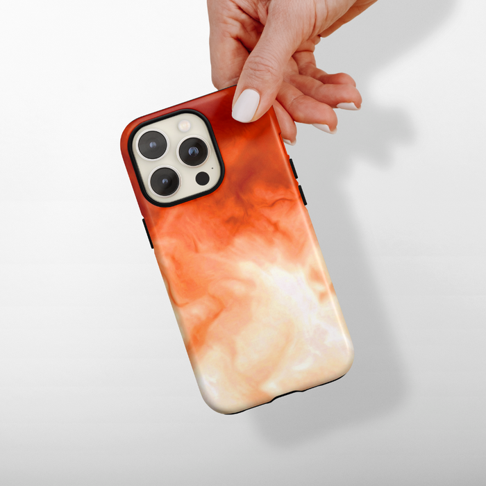Hand with white nails holding a beige Coconut Lane Tough Phone Case against a plain background.