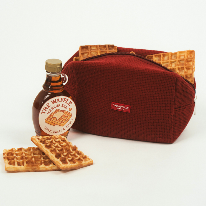 Burgundy Coconut Lane waffle makeup bag with textured waffle pattern and zip closure.